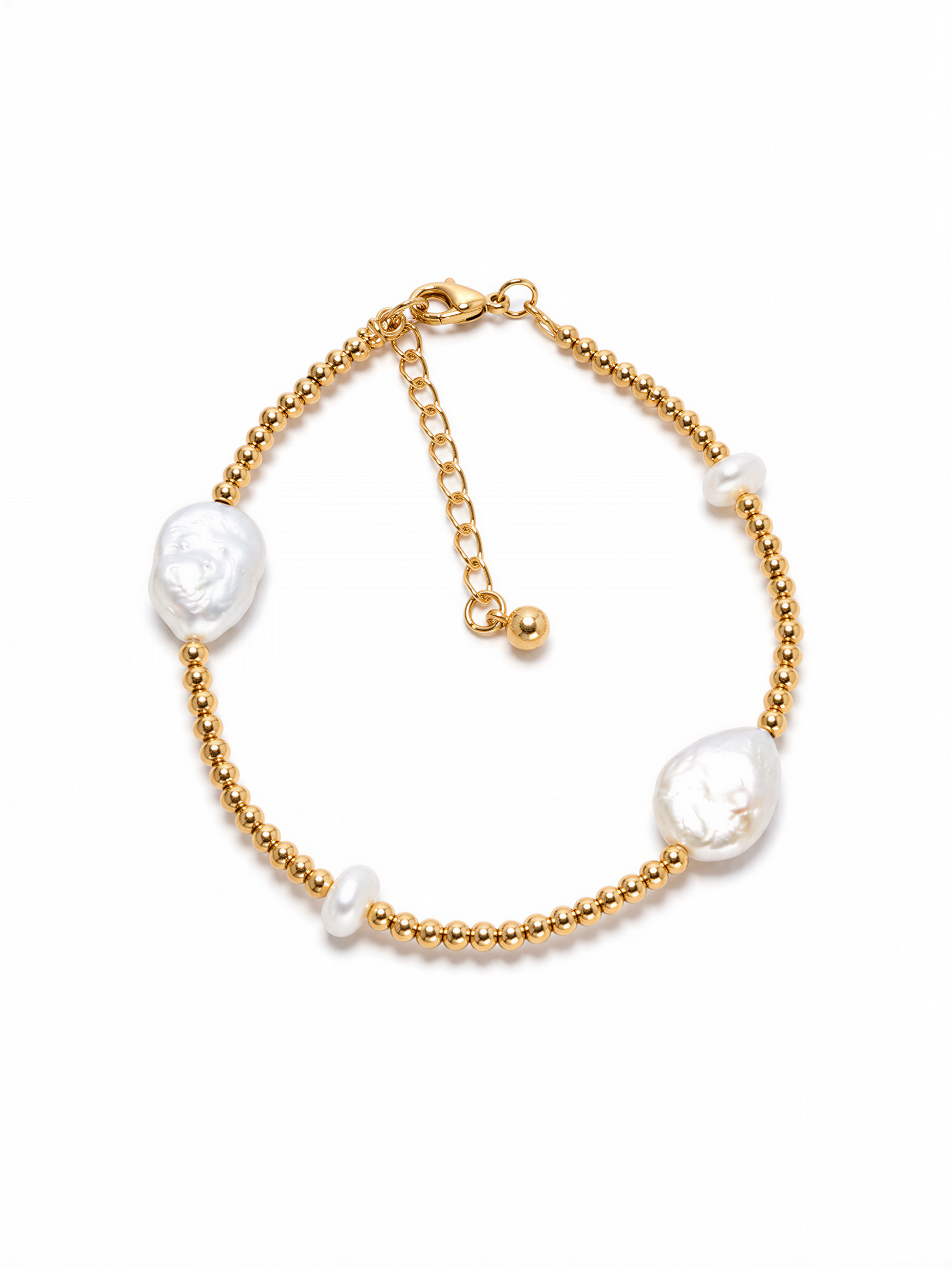 A gold-colored bracelet with three white pearls and three gold beads.