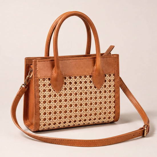 A brown leather handbag with a woven pattern on the front.