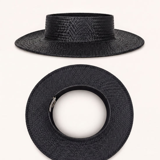 a black straw hat with a round brim and a silver buckle.