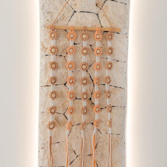 Flora Macrame Wall Hanging handmade by Village Thrive using natural materials.