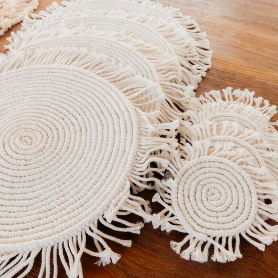Round Macrame Placemat and Coaster Set of 4 handmade by Village Thrive using natural materials.