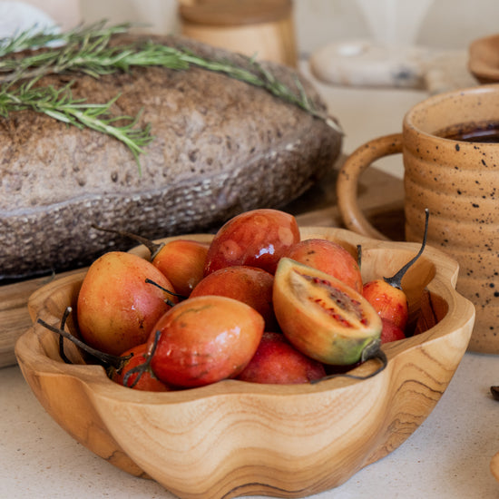Flora Teak Bowl handmade by Village Thrive using natural materials.