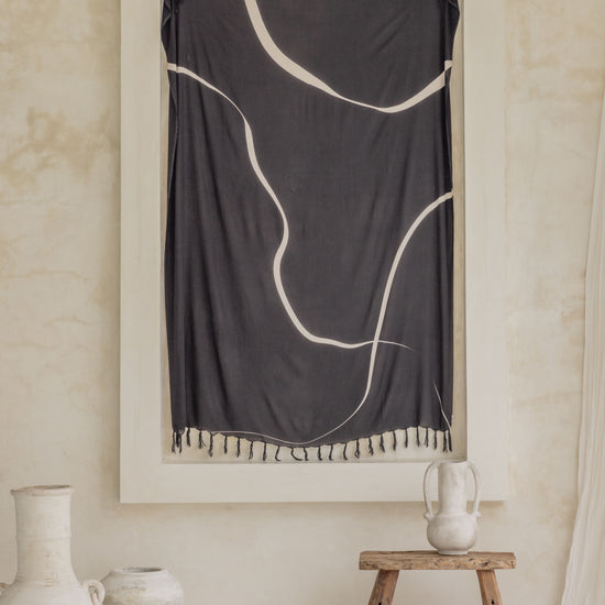 Minimalist Tapestry handmade by Village Thrive using natural materials.