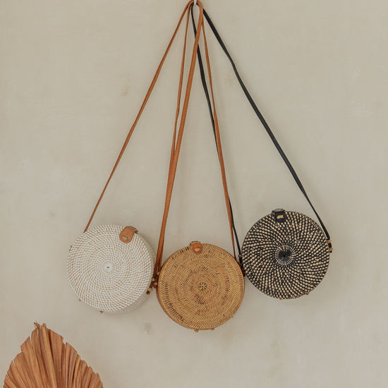 Round Rattan Purse handmade by Village Thrive using natural materials.