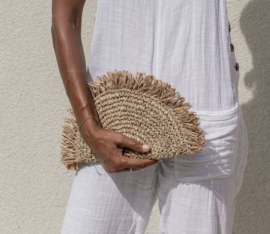 Seagrass Half Moon Clutch handmade by Village Thrive using natural materials.