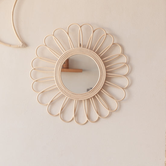 Bloom Rattan Mirror handmade by Village Thrive using natural materials.