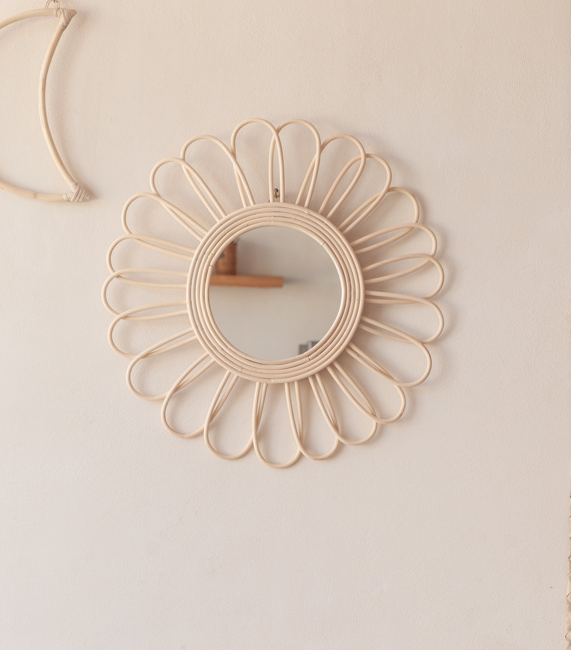 Bloom Rattan Mirror handmade by Village Thrive using natural materials.