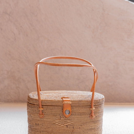 Opal Rattan Purse handmade by Village Thrive using natural materials.