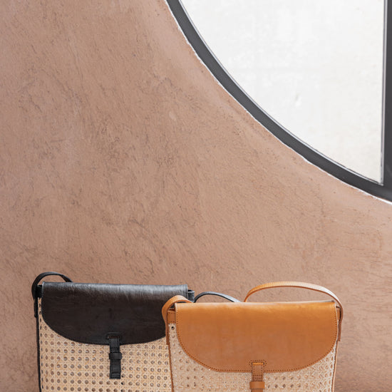 Rumi Leather and Cane Bucket Bag handmade by Village Thrive using natural materials.