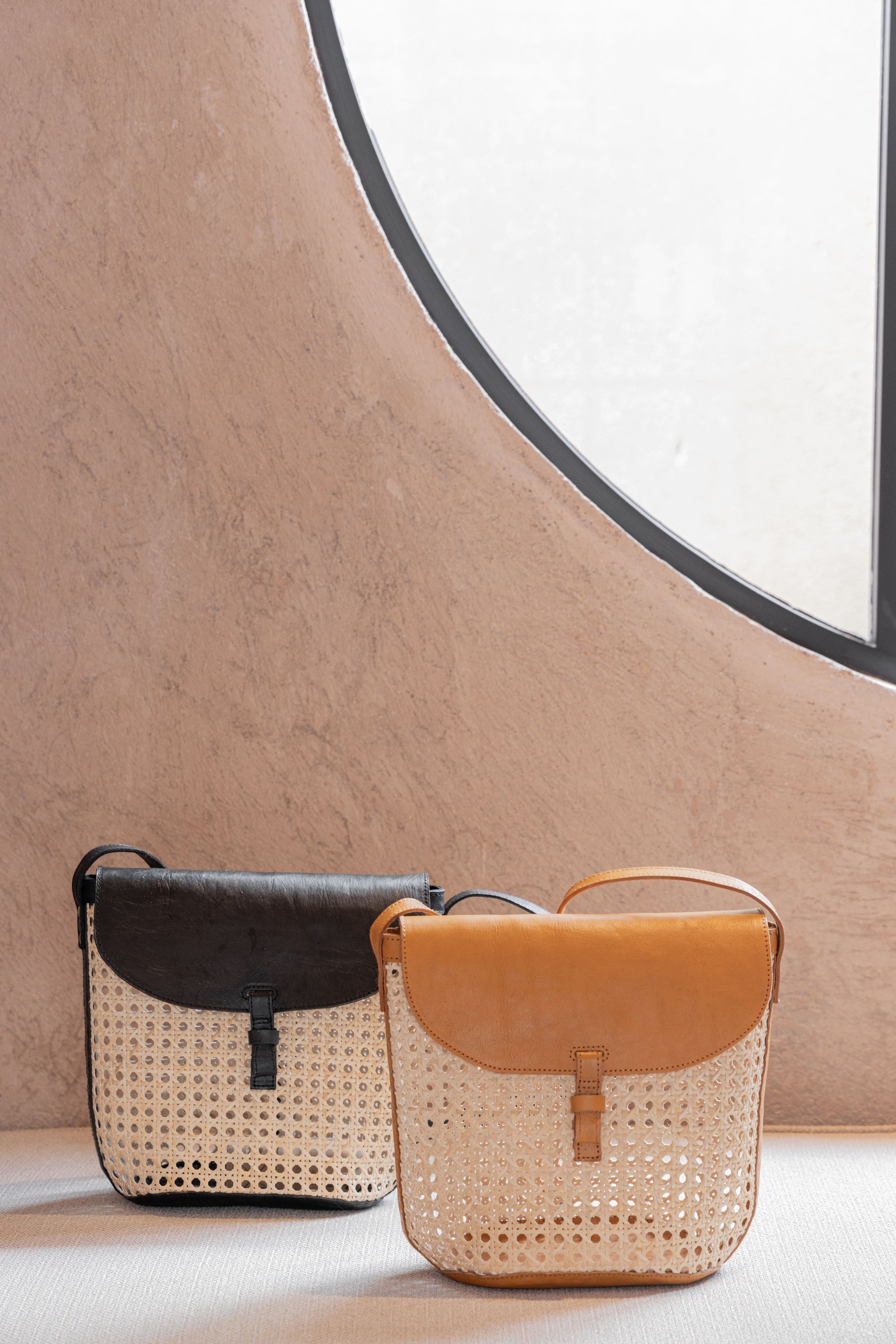 Rumi Leather and Cane Bucket Bag handmade by Village Thrive using natural materials.