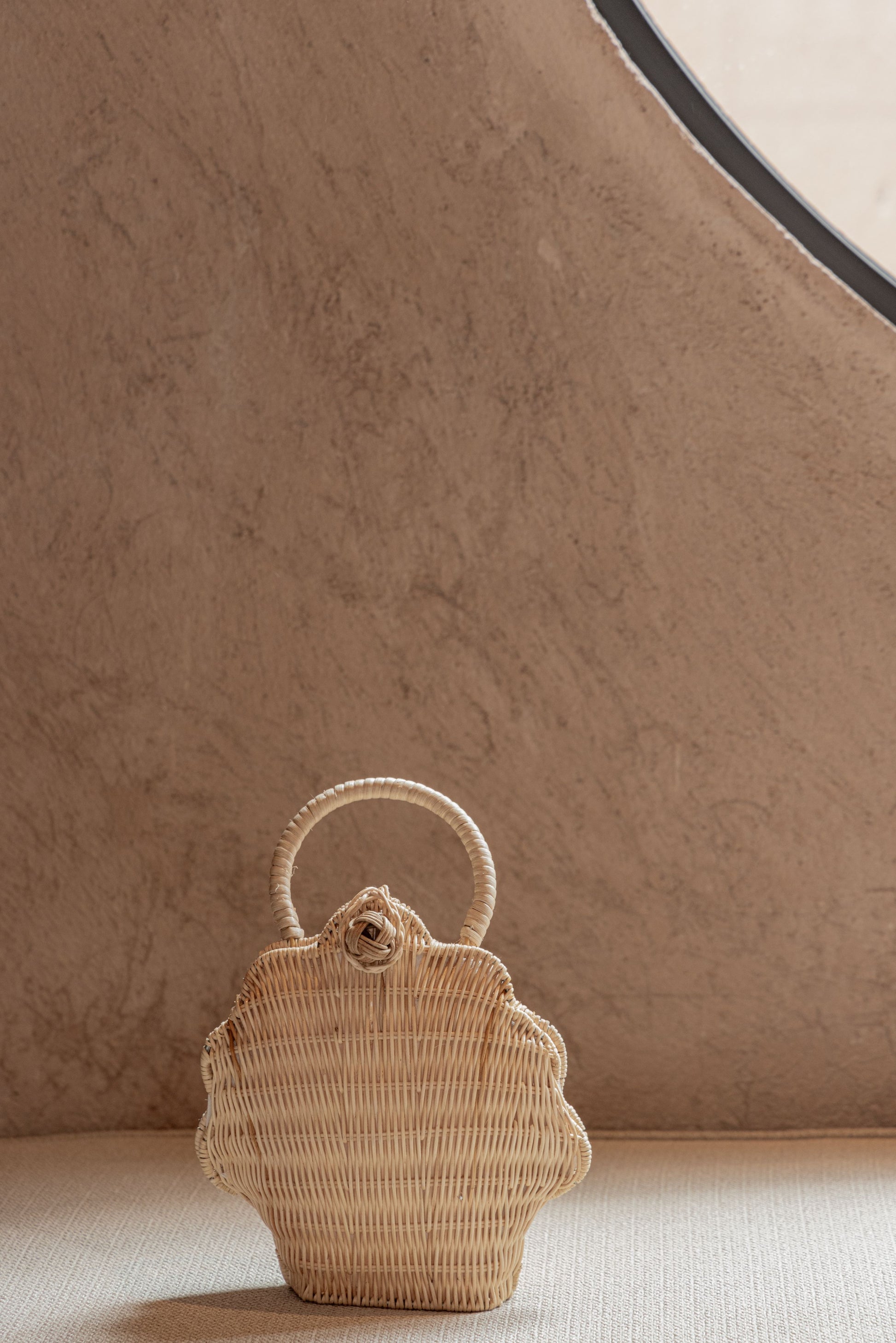 Kids Rattan Shell Purse handmade by Village Thrive using natural materials.