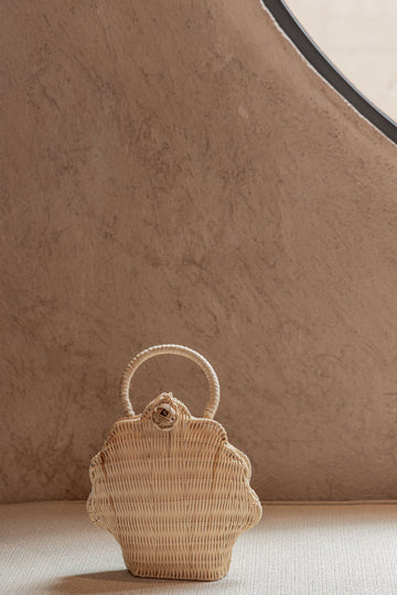Kids Rattan Shell Purse handmade by Village Thrive using natural materials.