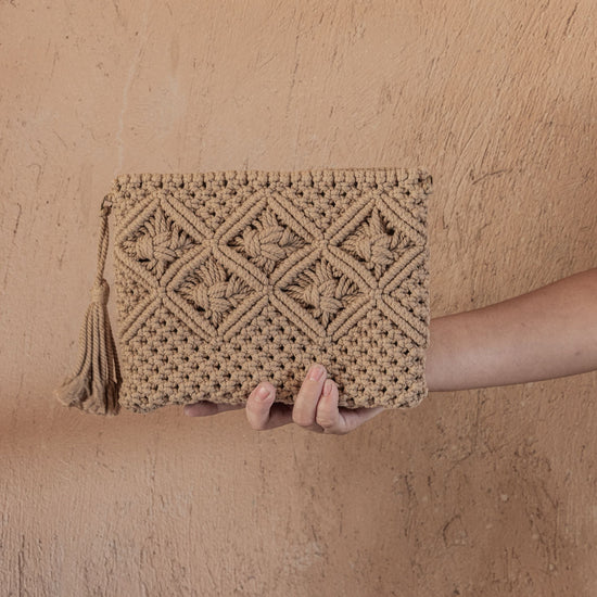 Ren Crochet Clutch handmade by Village Thrive using natural materials.