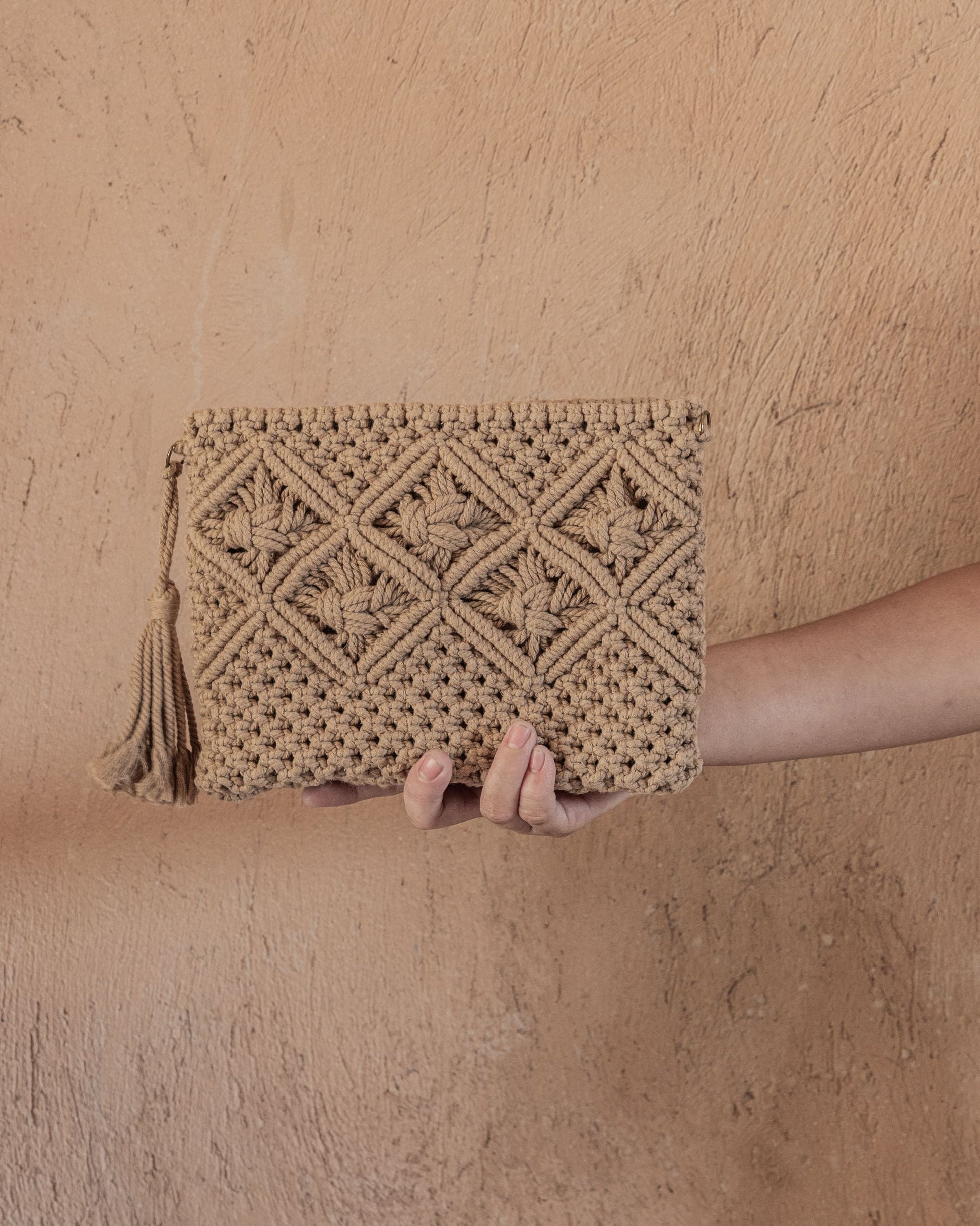 Ren Crochet Clutch handmade by Village Thrive using natural materials.