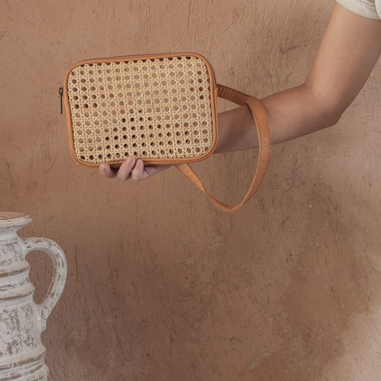 Vera Leather and Cane Belt Bag handmade by Village Thrive using natural materials.