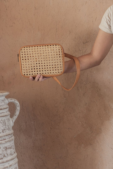 Vera Leather and Cane Belt Bag handmade by Village Thrive using natural materials.