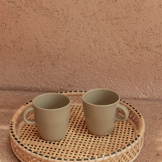 Nora Rattan Round Tray handmade by Village Thrive using natural materials.