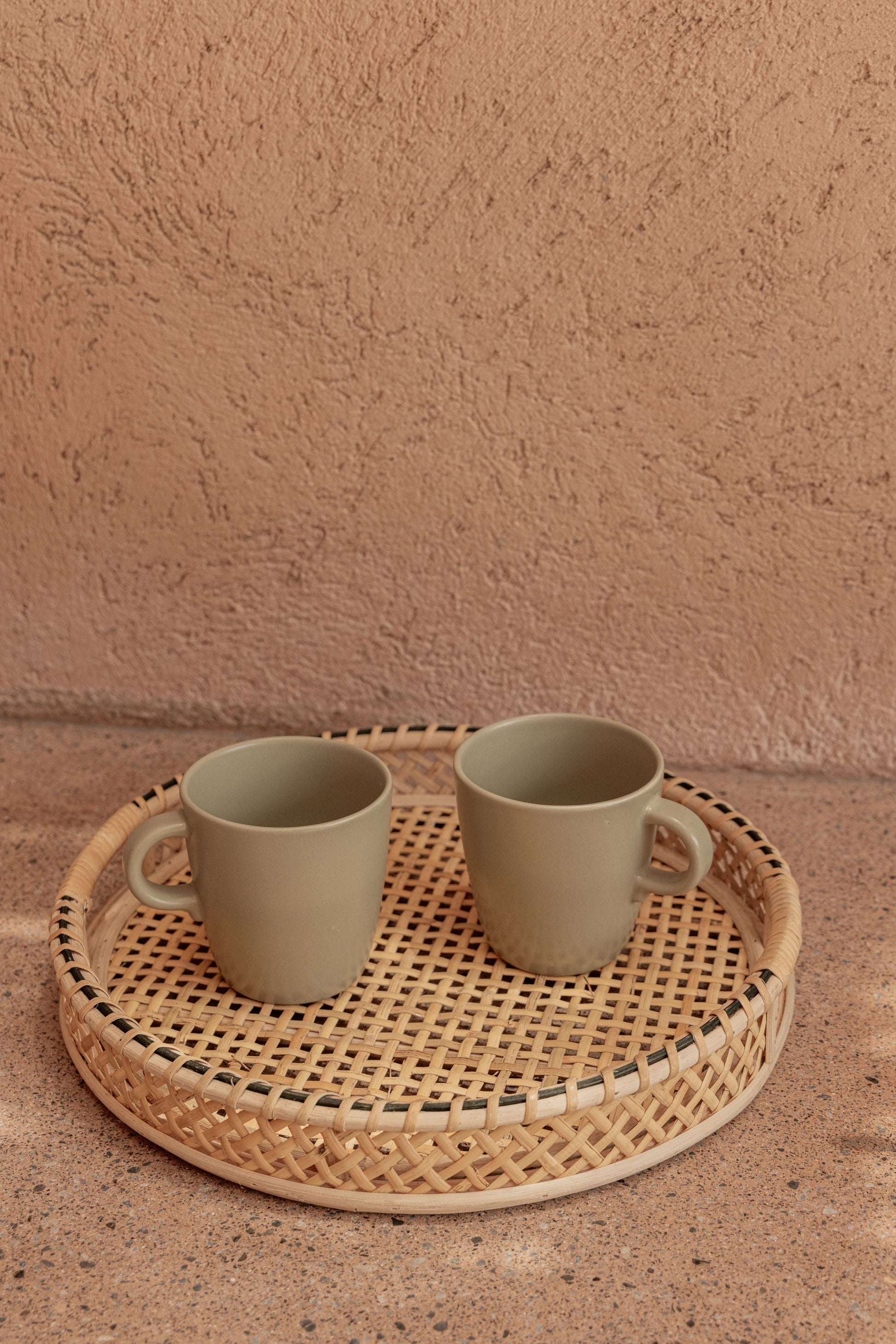 Nora Rattan Round Tray handmade by Village Thrive using natural materials.