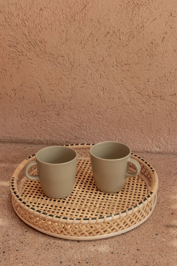 Nora Rattan Round Tray handmade by Village Thrive using natural materials.