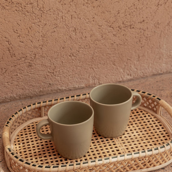 Nora Rattan Oval Tray handmade by Village Thrive using natural materials.