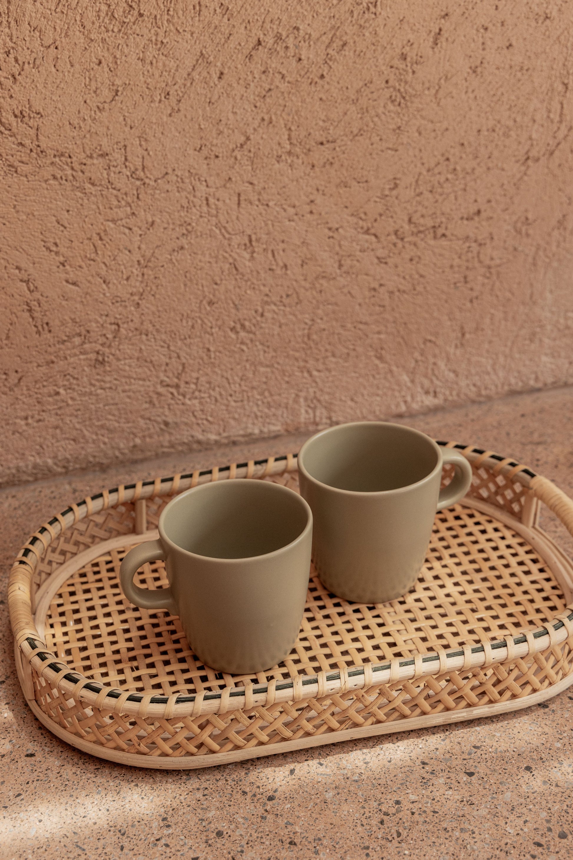Nora Rattan Oval Tray handmade by Village Thrive using natural materials.