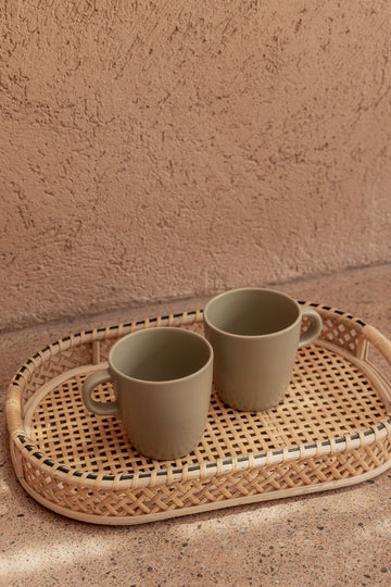 Nora Rattan Oval Tray handmade by Village Thrive using natural materials.