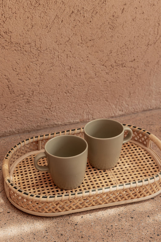 Nora Rattan Oval Tray handmade by Village Thrive using natural materials.