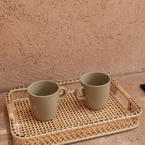 Nora Rattan Serving Tray handmade by Village Thrive using natural materials.