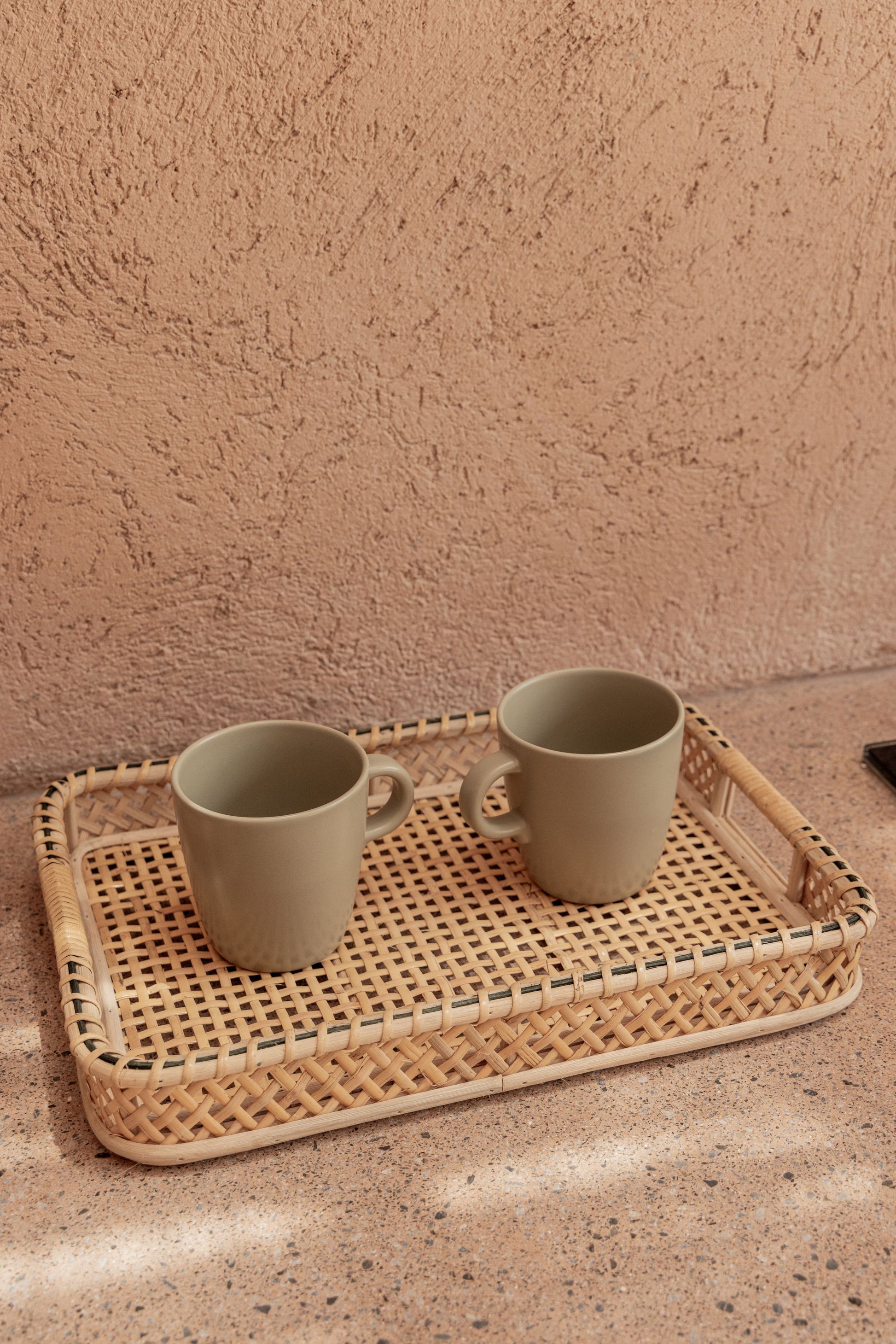 Nora Rattan Serving Tray handmade by Village Thrive using natural materials.