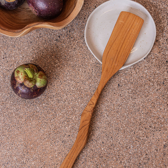 Teak Wavy Spatulas handmade by Village Thrive using natural materials.