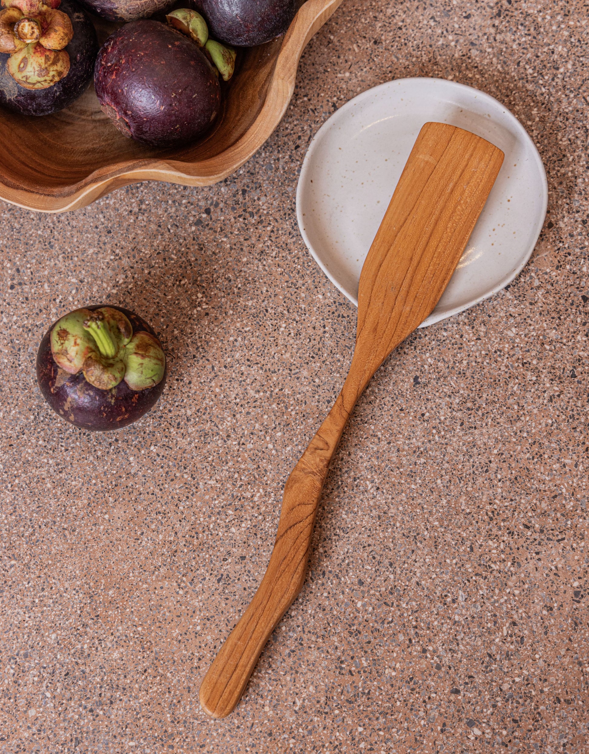 Teak Wavy Spatulas handmade by Village Thrive using natural materials.