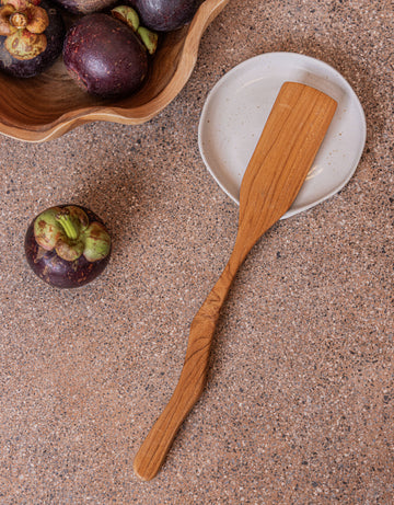 Teak Wavy Spatulas handmade by Village Thrive using natural materials.