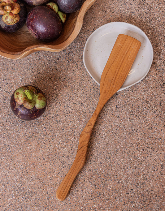 Teak Wavy Spatulas handmade by Village Thrive using natural materials.