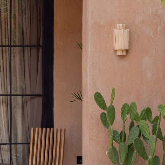 Maya Rattan Wall Sconce PREORDER handmade by Village Thrive using natural materials.