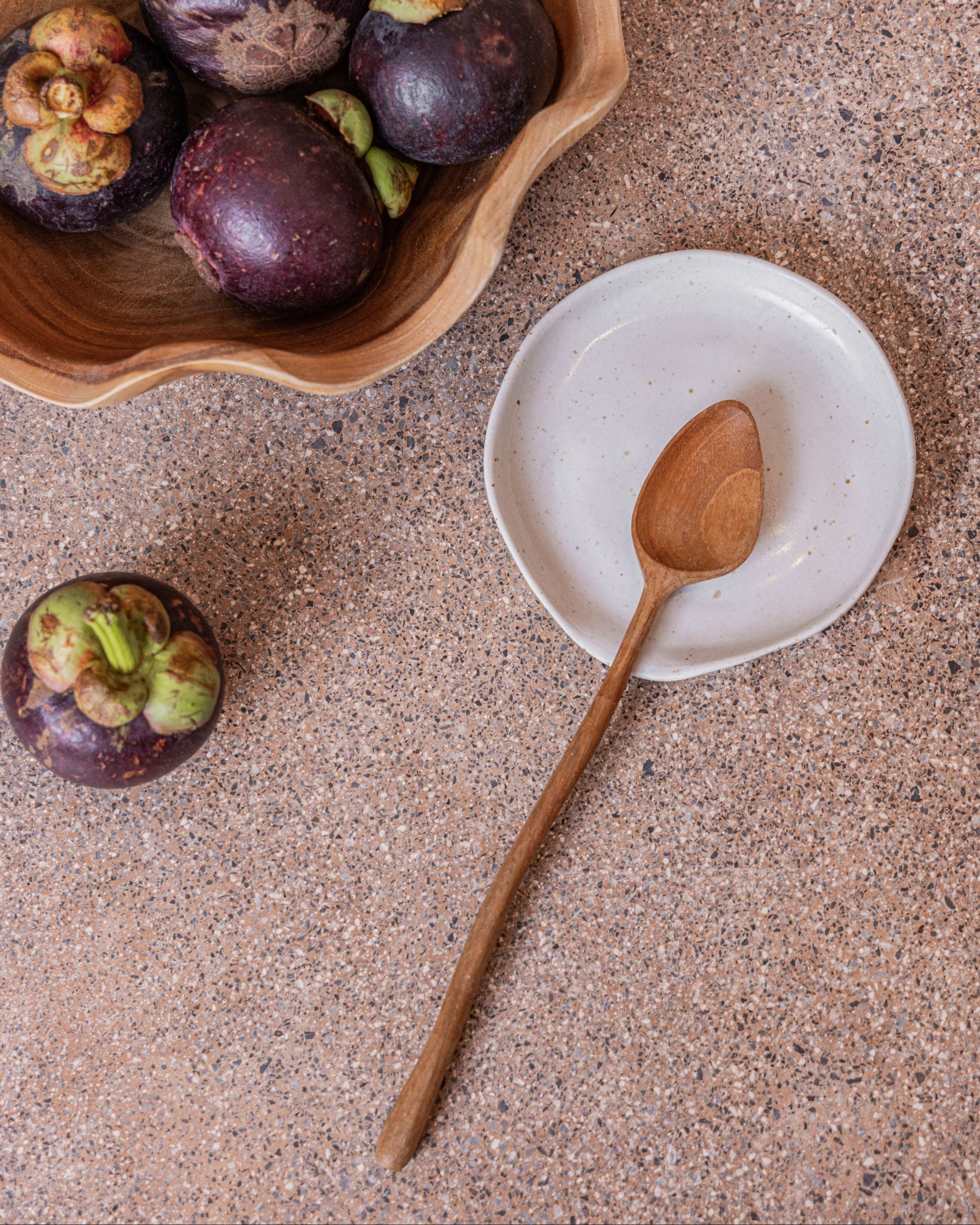 Wabi Ceramic Spoon Rest handmade by Village Thrive using natural materials.