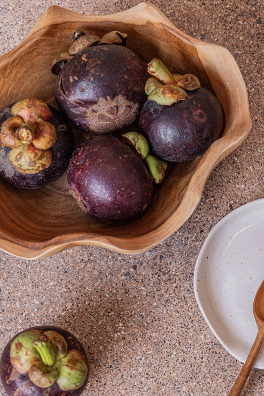 Teak Wavy Bowl handmade by Village Thrive using natural materials.