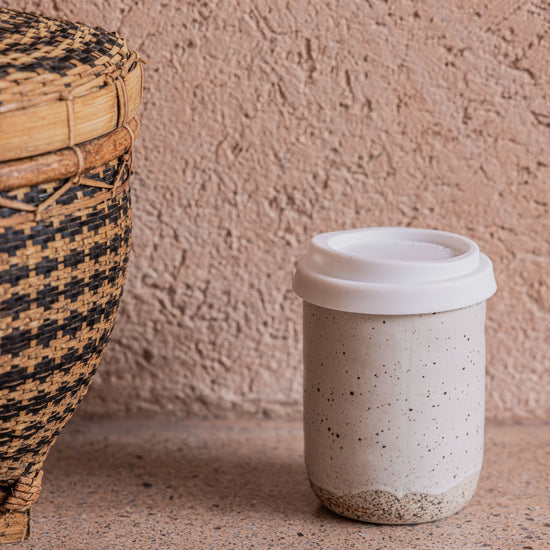 Wabi Ceramic To Go Mug handmade by Village Thrive using natural materials.
