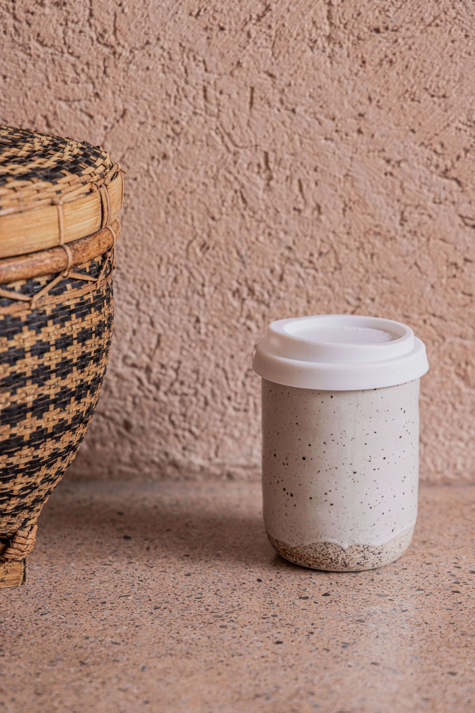 Wabi Ceramic To Go Mug handmade by Village Thrive using natural materials.