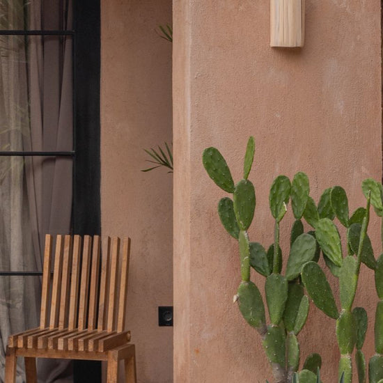Modern Rattan Wall Sconce PREORDER handmade by Village Thrive using natural materials.