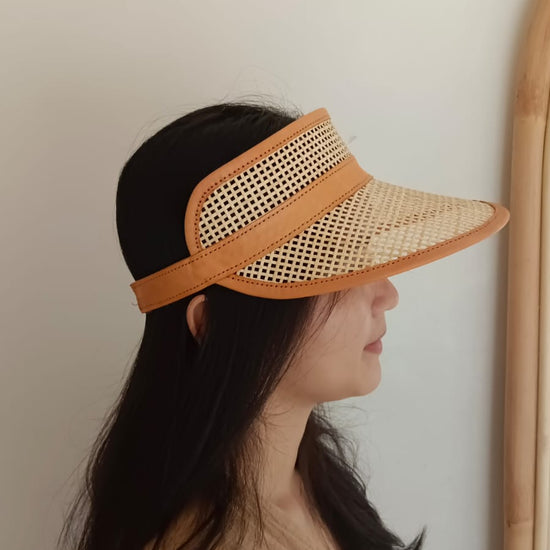 Sumi Leather and Cane Rattan Visor for Kids handmade by Village Thrive using natural materials.