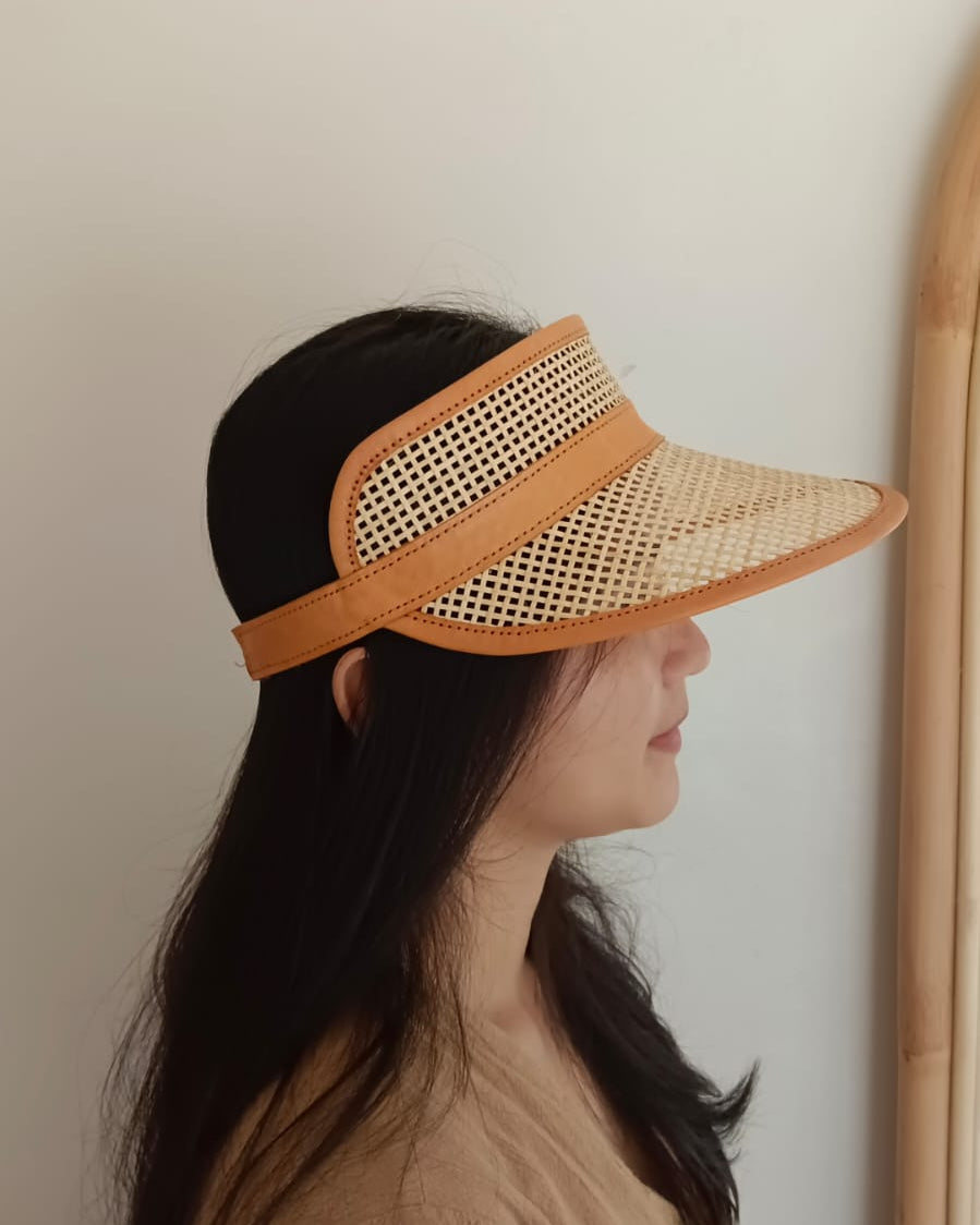 Sumi Leather and Cane Rattan Visor for Kids handmade by Village Thrive using natural materials.