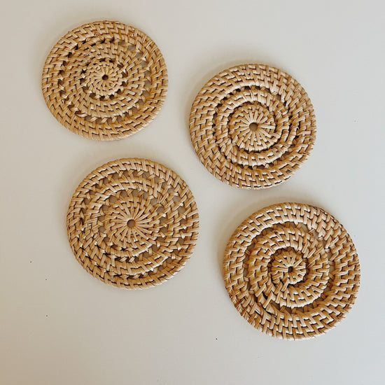 Woven Rattan Coaster Set handmade by Village Thrive using natural materials.