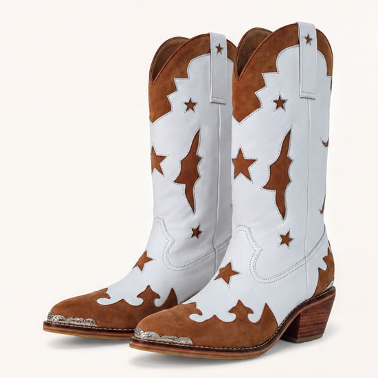 A pair of white cowboy boots with brown star patterns on the sides and heels.