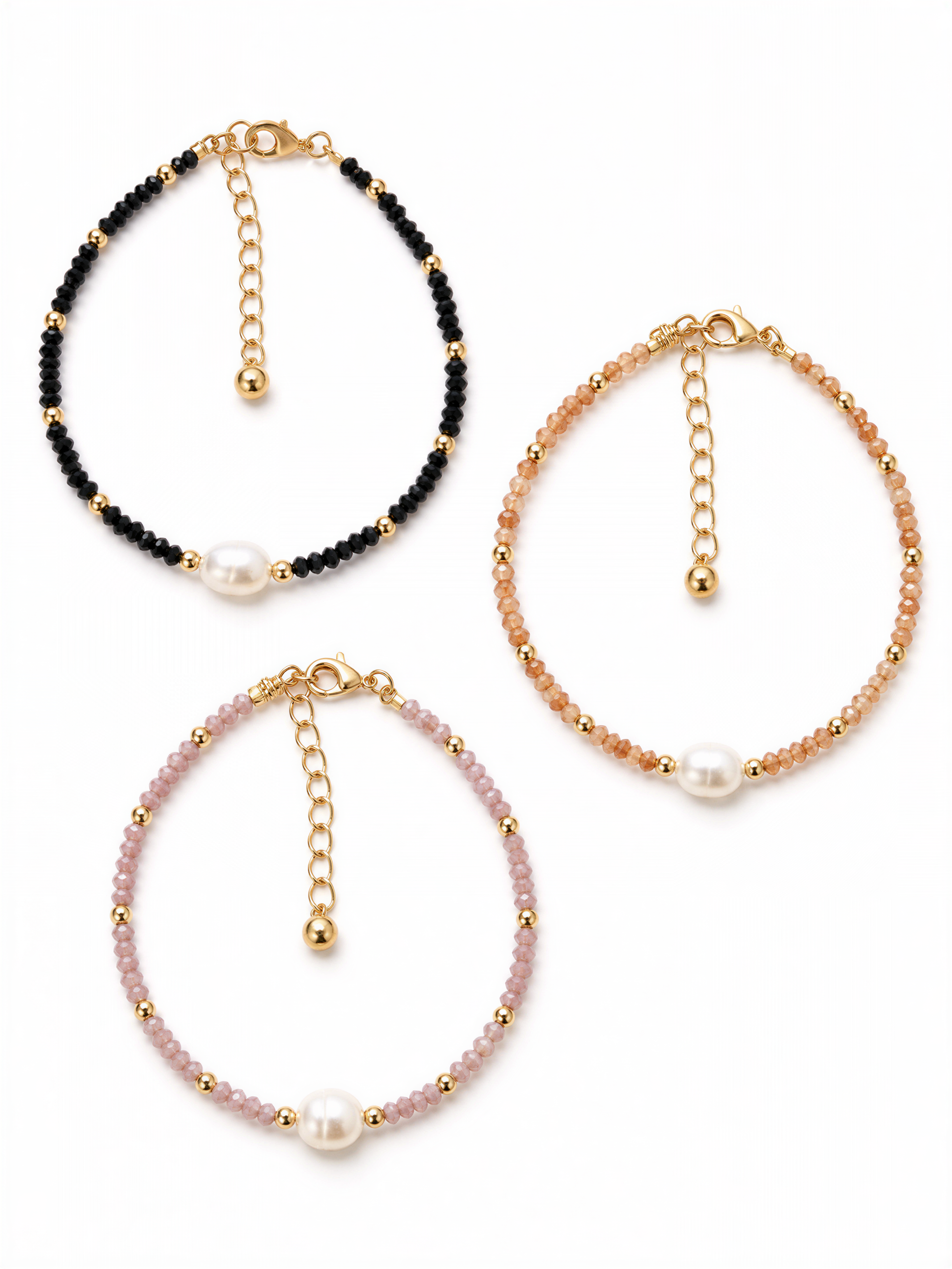three beaded bracelets with pearls attached, each with a unique color and design.