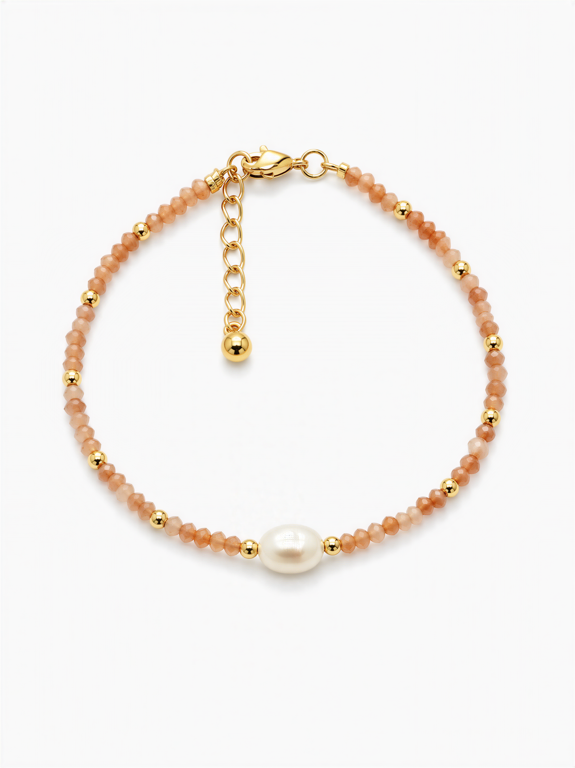 A gold-colored bracelet with a pearl bead and beaded beads in shades of orange and gold.