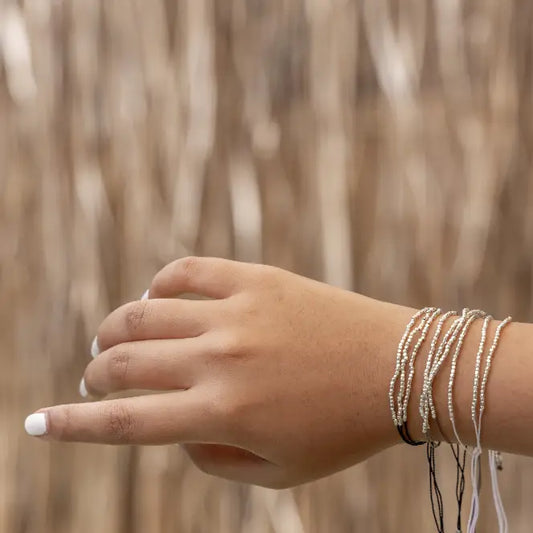 Terra Layered Bracelets in Silver handmade by Village Thrive using natural materials.
