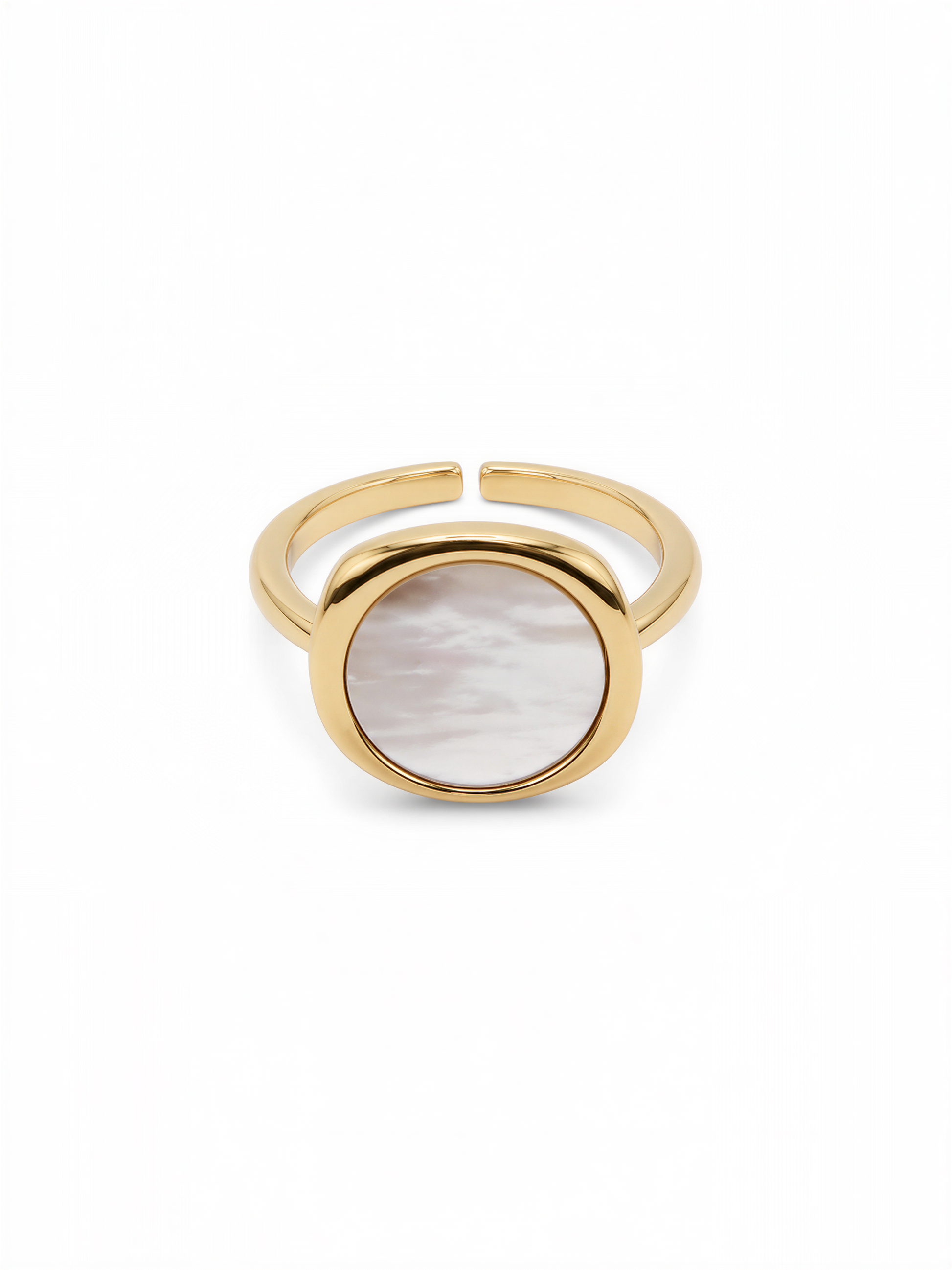 A gold ring with a round oval-shaped stone in the center.