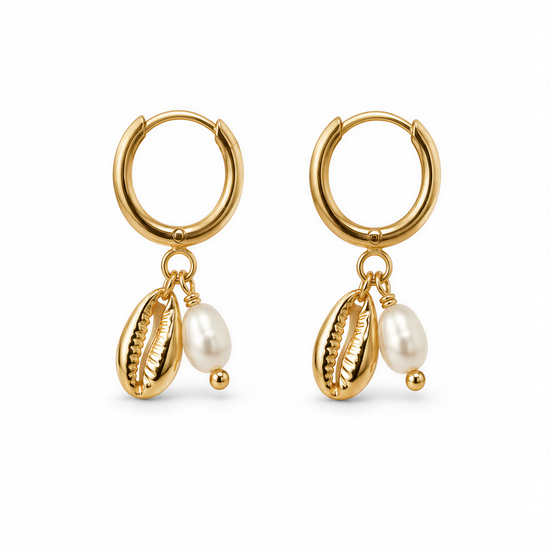 A pair of gold earrings with shells and pearls hanging from them.