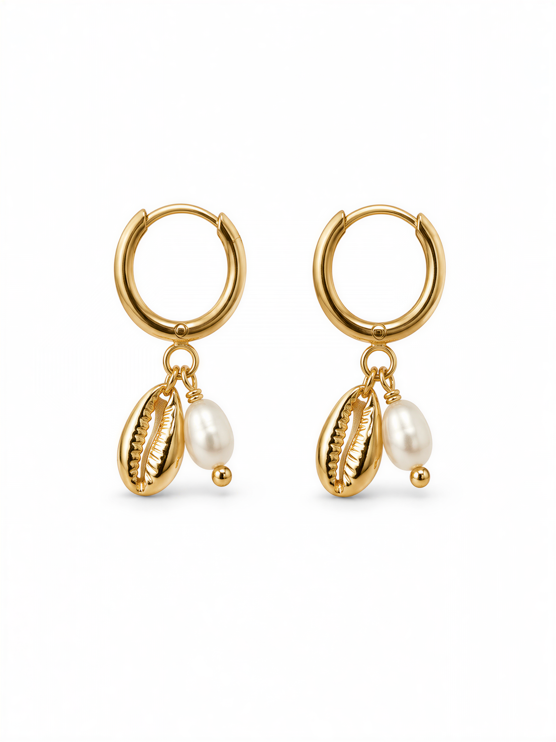 A pair of gold earrings with shells and pearls hanging from them.