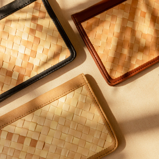 Cove Rattan & Leather Passport Cover handmade by Village Thrive using natural materials.